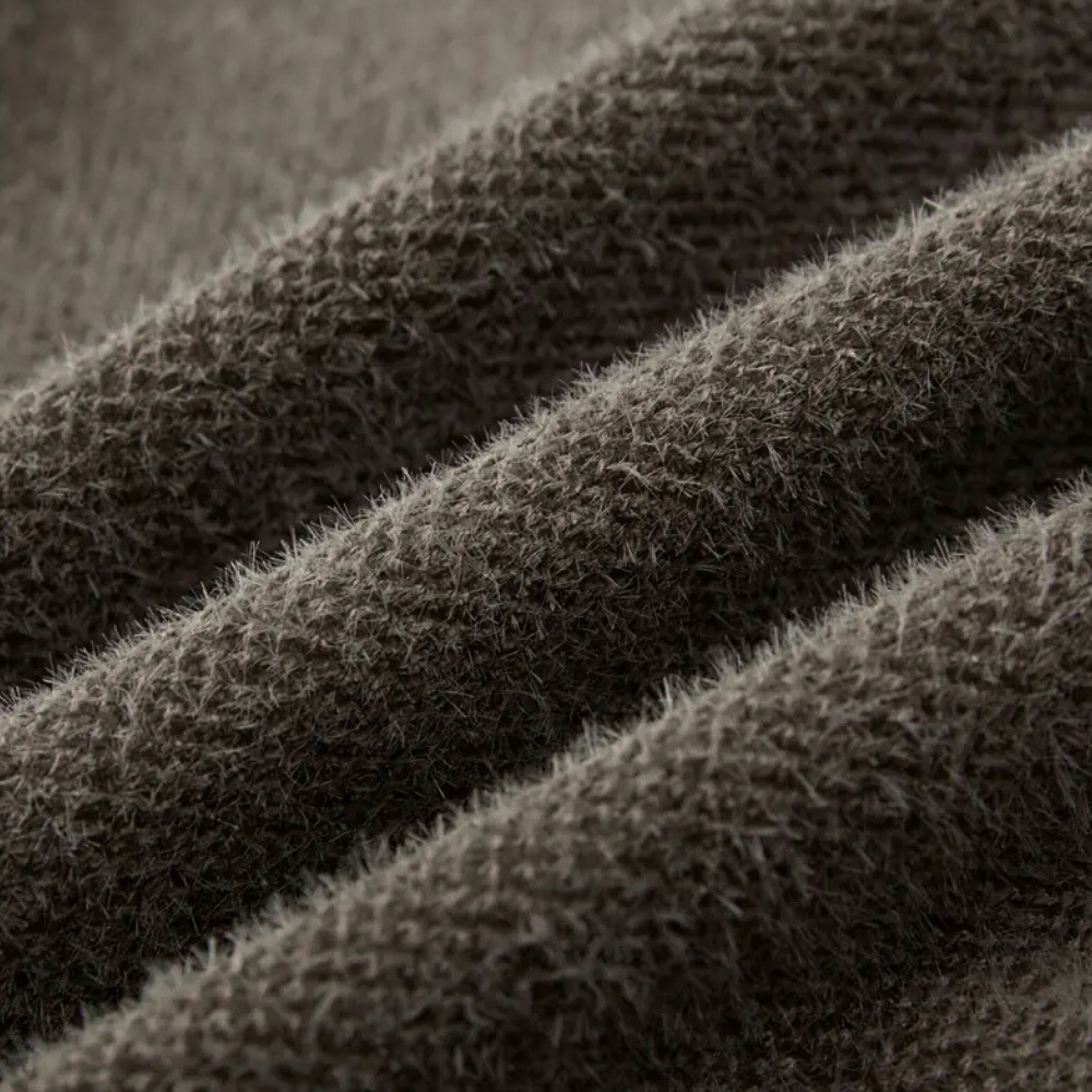 Brauner Wollstoff, Nahaufnahme, weiche Textur, hochwertige Bekleidungsmaterialien, gemütlich.