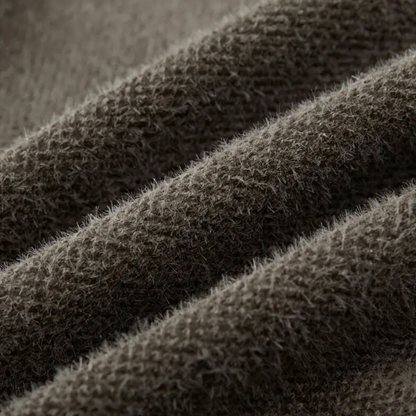 Brauner Wollstoff, Nahaufnahme, weiche Textur, hochwertige Bekleidungsmaterialien, gemütlich.